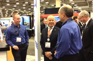 FAA Michael Huerta, center, visits with Kansas Aviation Director, Merrill Atwater, left and Bob Brock, Kansas Director of UAS. 